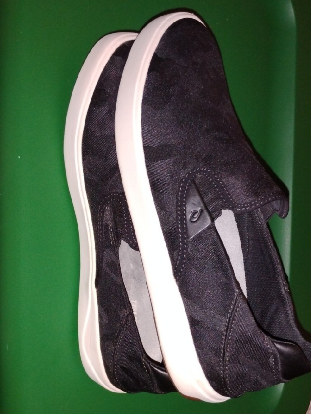OluKai Men’s Black Camo Slip-On Sneakers with White Midsole - Picture 3 of 6